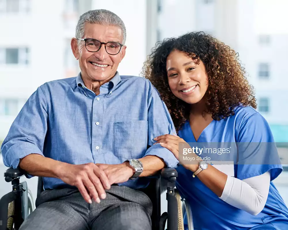 Caregiver with senior man in wheelchair