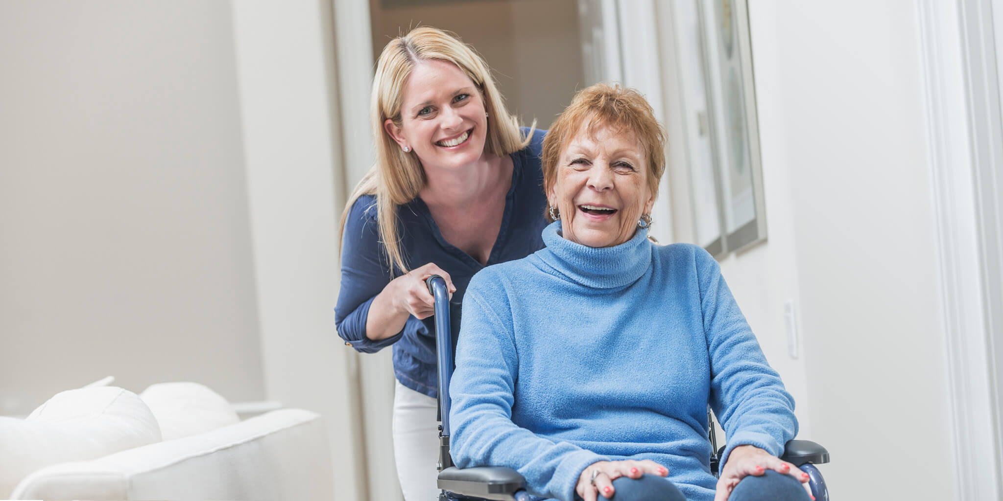 Caregiver with woman in wheelchair